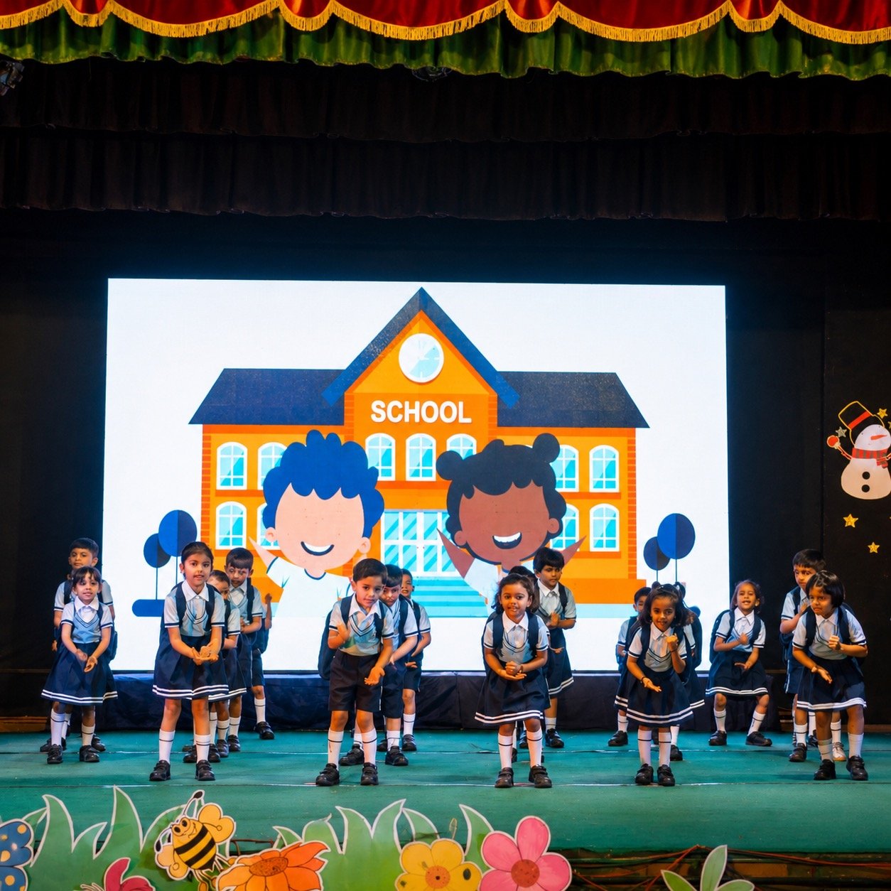 Young students performing a school-themed dance at Annual Day