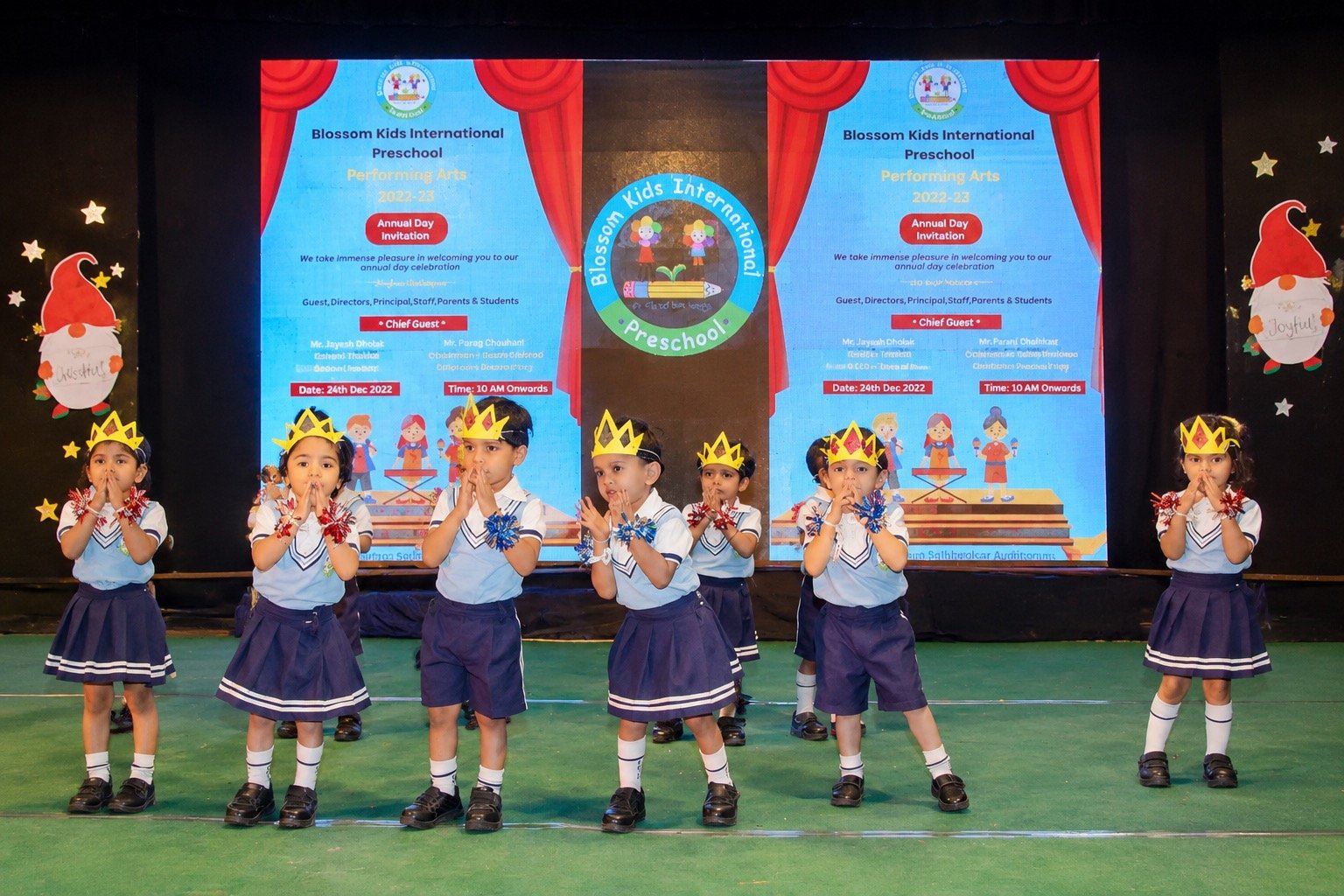 Tiny tots in crowns performing on stage at the Annual Day celebration